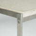 Close up view of corner on white marble Kjaerholm PK63 coffee table