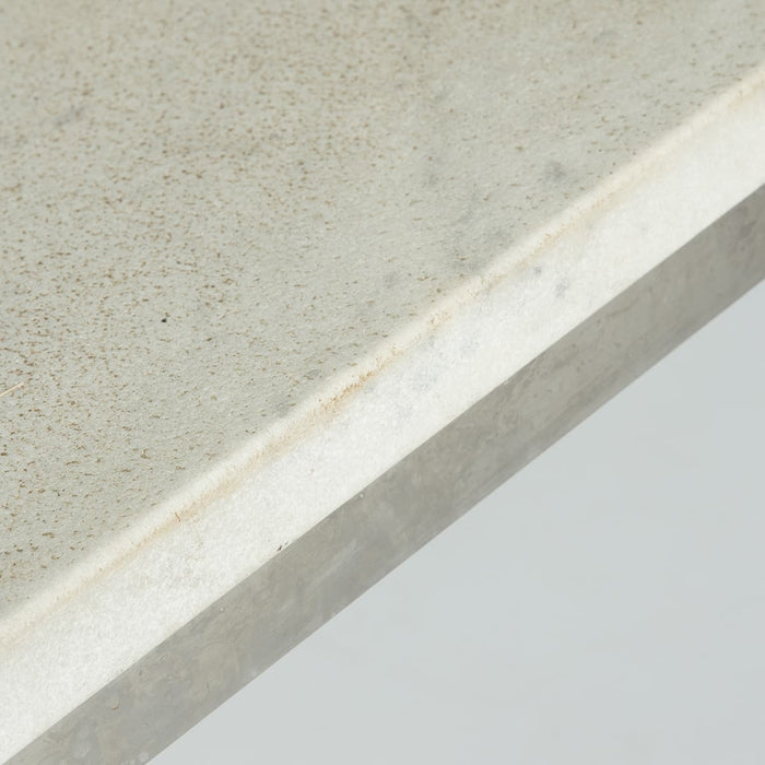 Close up edge view of white marble Kjaerholm PK63 coffee table