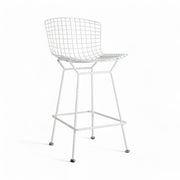Front angled view of white Bertoia barstool