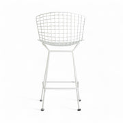 Rear view of white Bertoia barstool