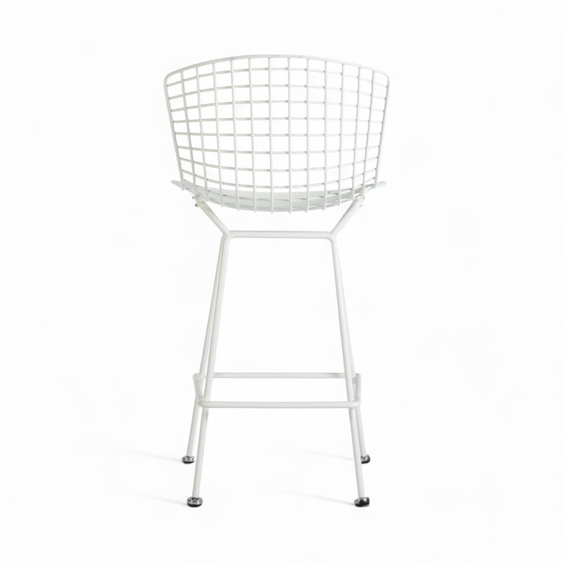 Rear view of white Bertoia barstool