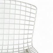 Close up front view of white Bertoia barstool