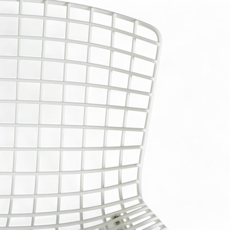 Close up front view of white Bertoia barstool