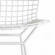 Artistic front view of white Bertoia barstool