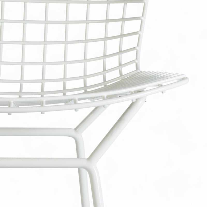 Artistic front view of white Bertoia barstool