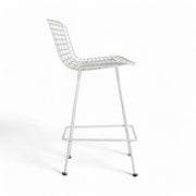 Right side view of white Bertoia barstool
