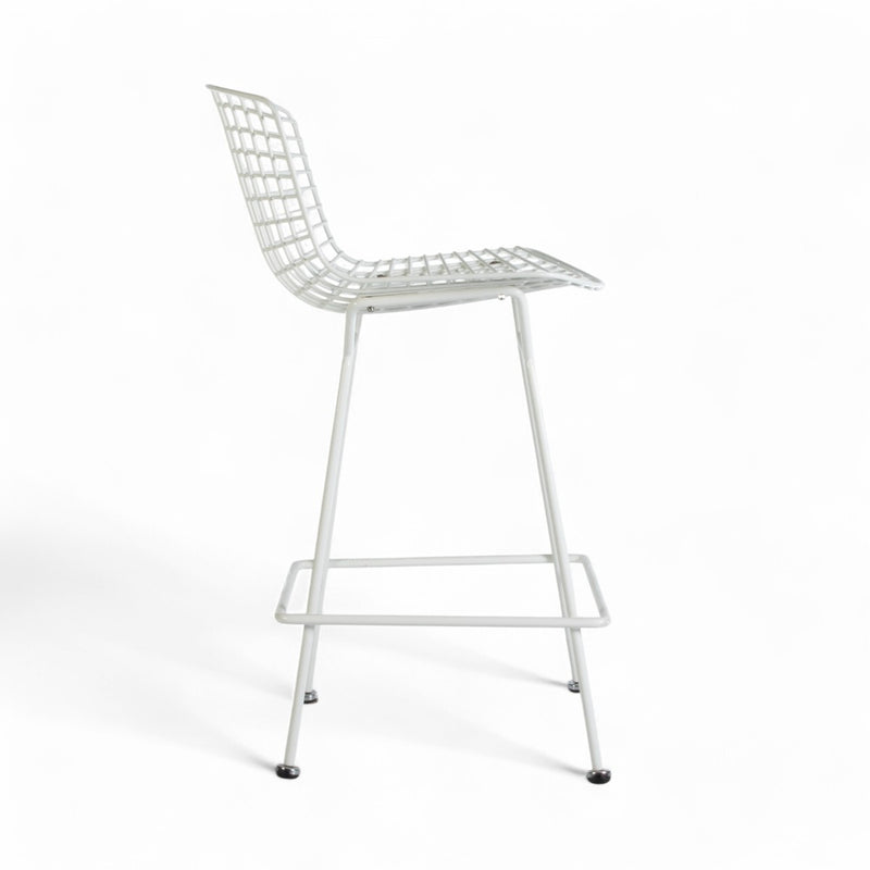 Right side view of white Bertoia barstool