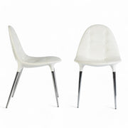 View of pair of Cassina Starck Caprice chairs, one from right side, one from front