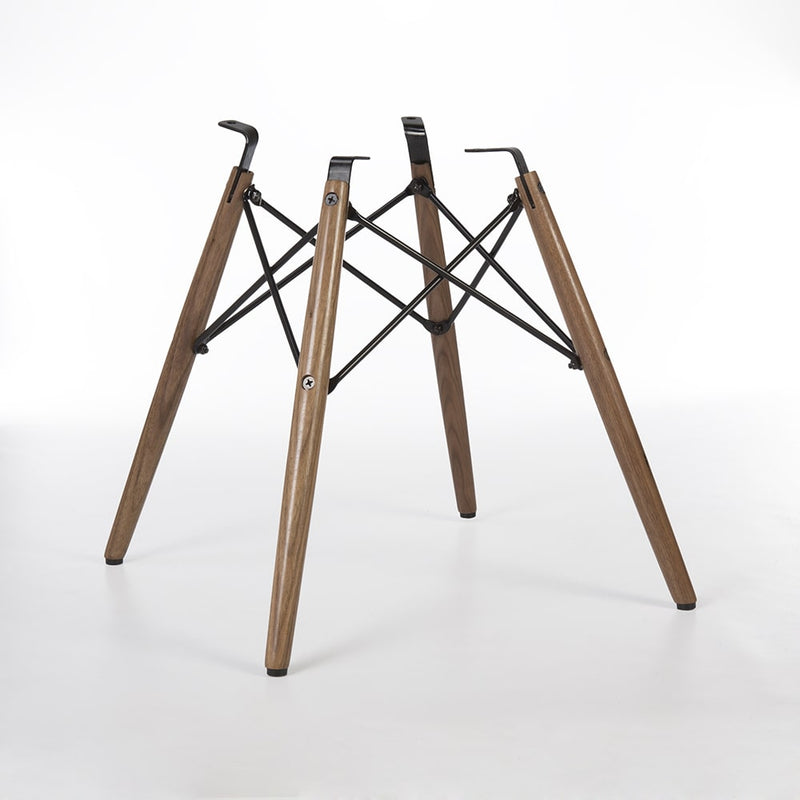 Rear angled view of walnut Eames dowel base