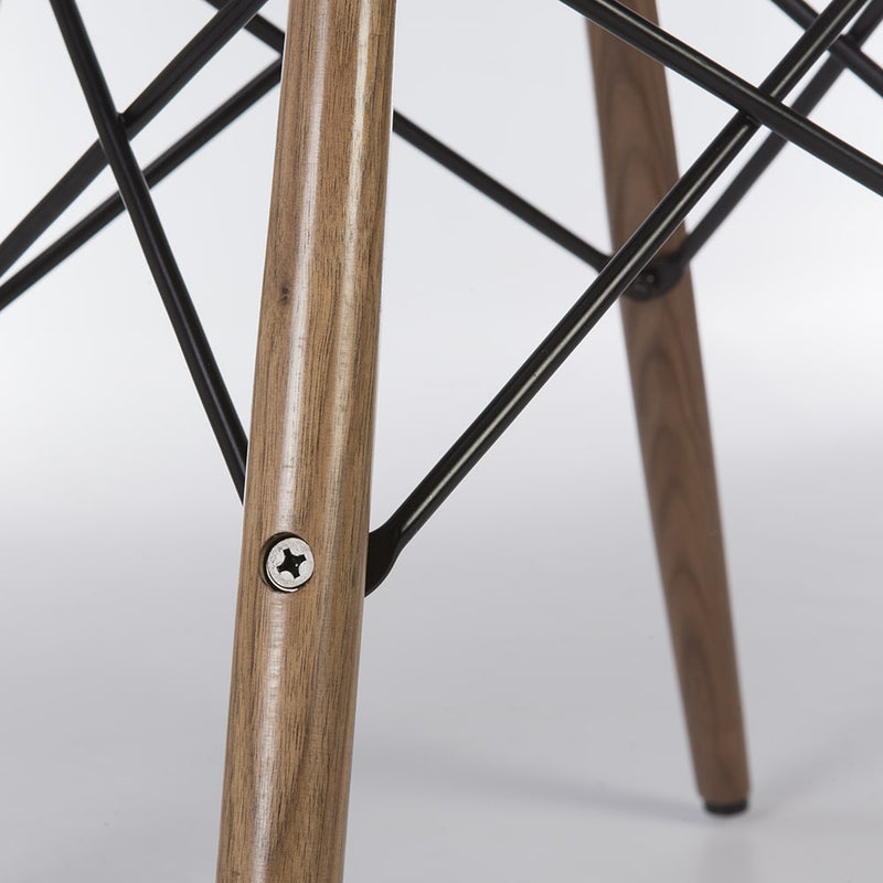 Close up view of walnut Eames dowel base