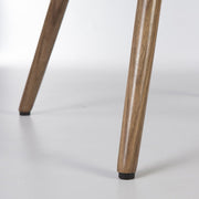 Close up view of lower leg on walnut Eames dowel base