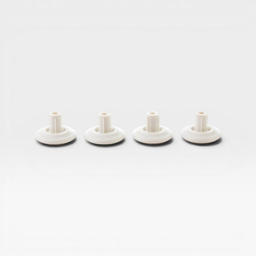 Image of full set of four white glides for Eames Office, Aluminium Lounge and Vitra Lounge Chair