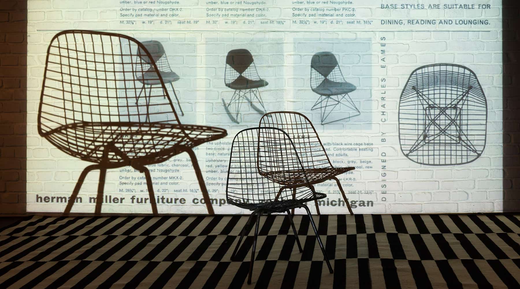 An artistic slide projection of an original and early Eames DKR wire side dining chair made by Herman Miller in 1951